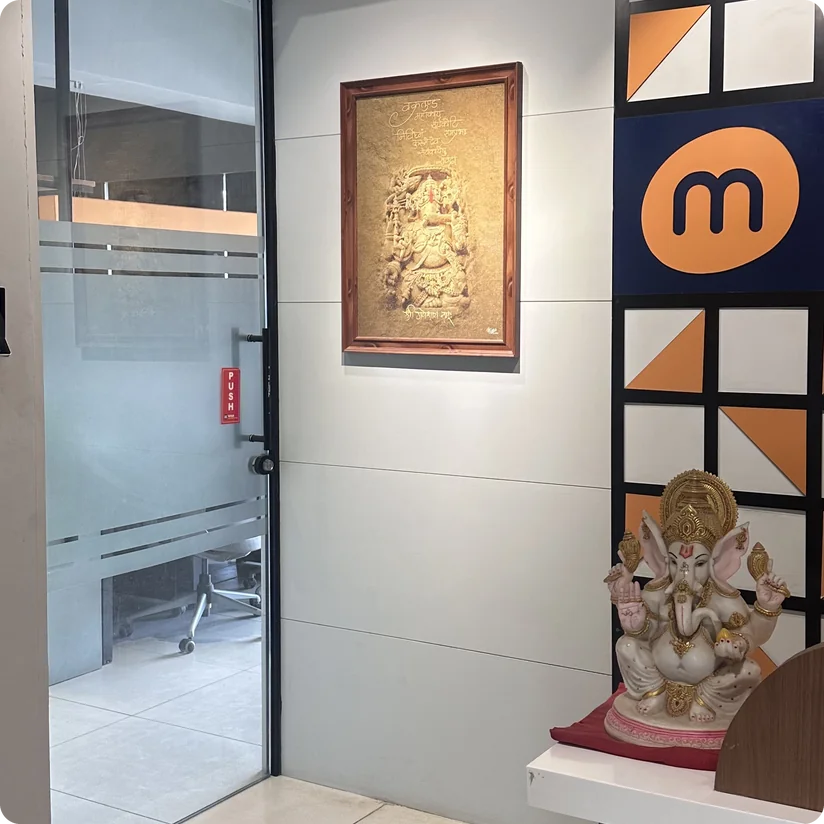 Mindphin office entrance with the logo wall and a Ganesha idol