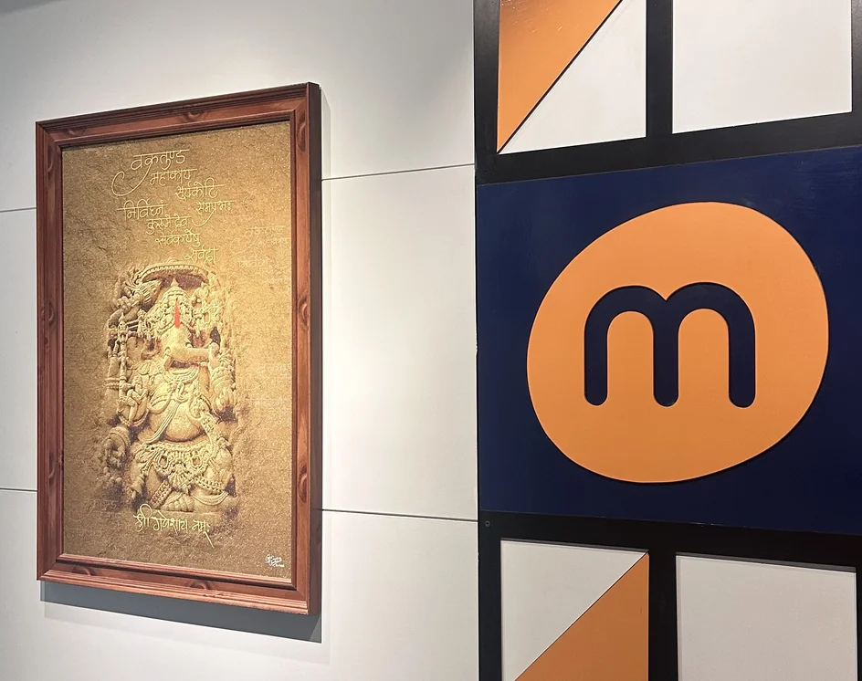 Framed Ganesha artwork next to the Mindphin logo on the reception wall