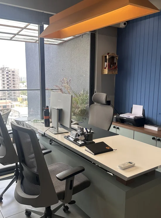 Cabin desk and chair beside a window in the Mindphin office